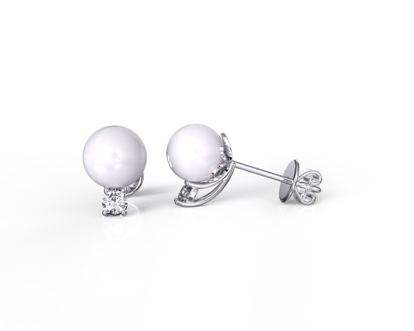a pair of akoya pearl diamond stud earrings with one of it facing side view